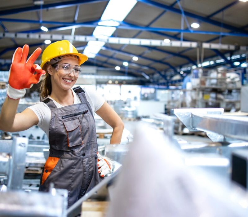 portrait-of-female-factory-worker-showing-okay-sign_342744-158